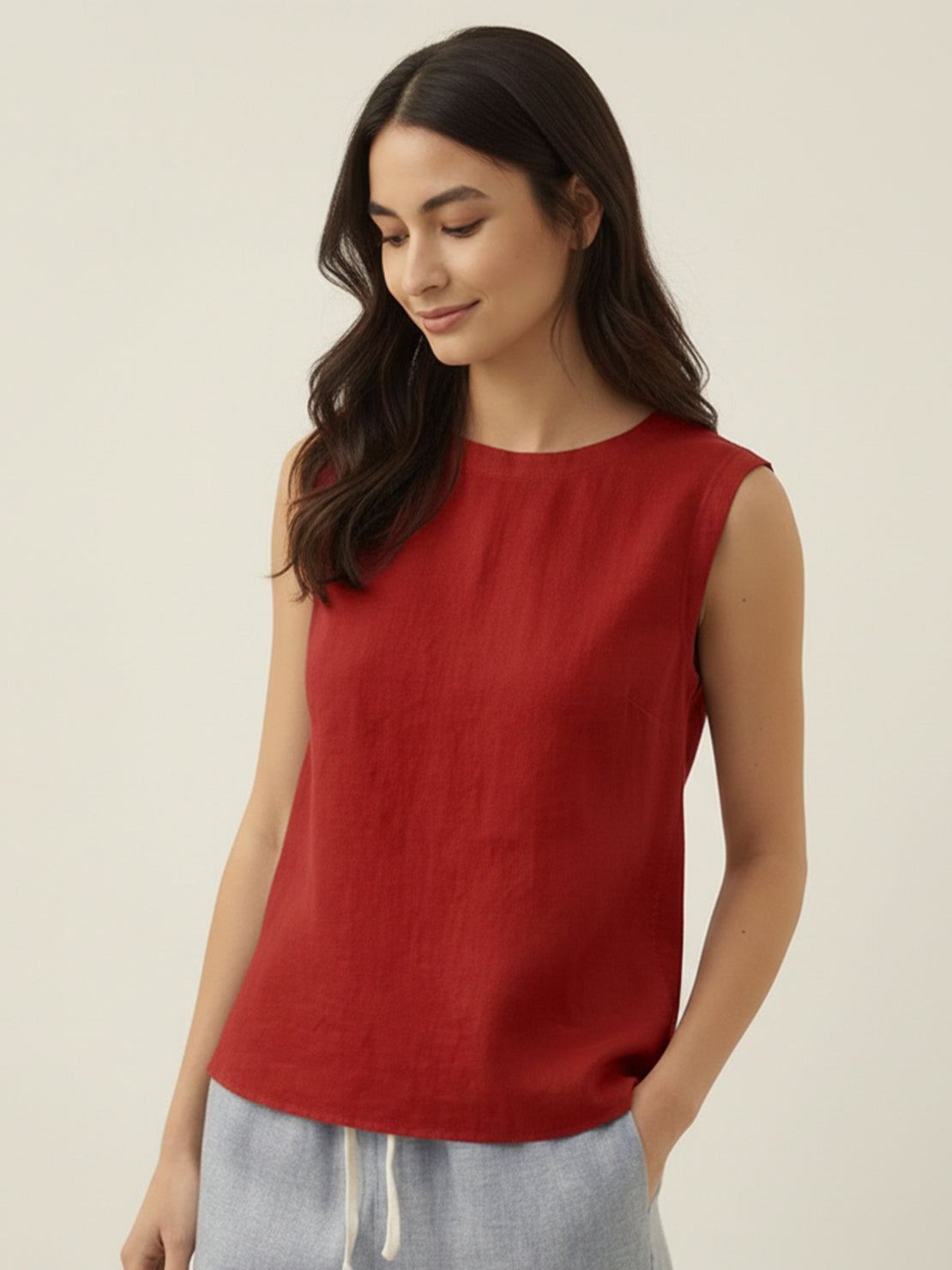 Cotton-linen sleeveless top with round neckline and button back closure in relaxed A-line silhouette