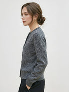 Marled knit merino wool cardigan with button front and ribbed cuffs