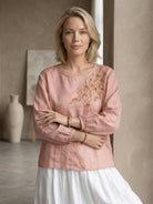 100% cotton-linen embroidered blouse with relaxed fit, balloon sleeves, and tonal floral detail on shoulder