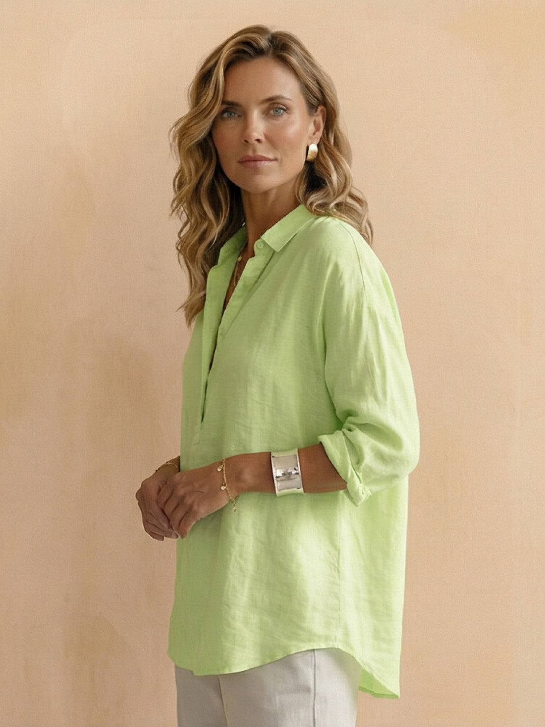 Lightweight 100% cotton popover blouse with relaxed fit, classic collar, and tunic length with curved hem.