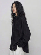 100% cotton-linen oversized shirt with dropped shoulders and curved hem in breathable fabric