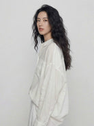 White oversized 100% cotton-linen relaxed fit shirt with dropped shoulders and curved hem