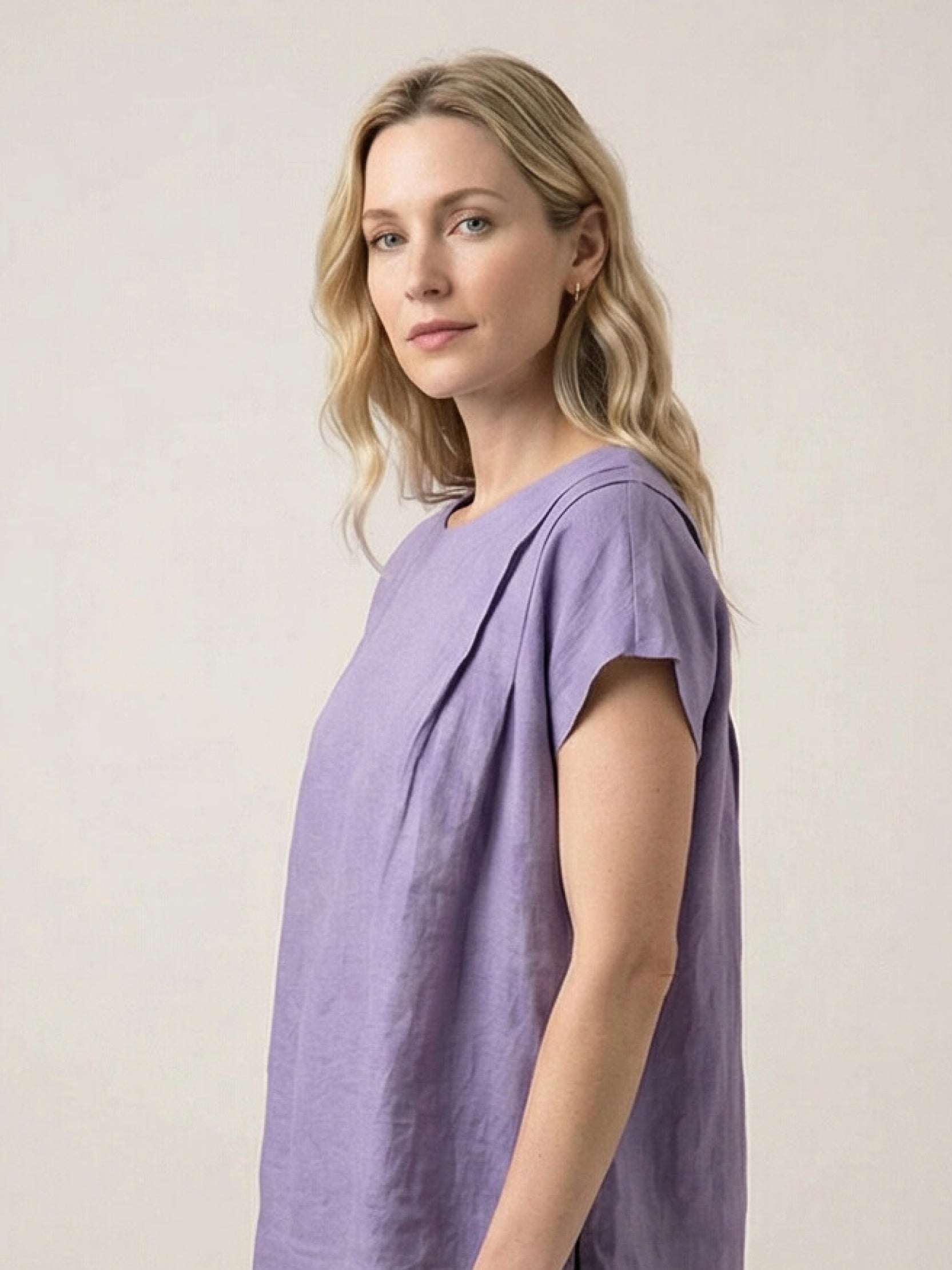 100% linen boxy cap-sleeve top with round scoop neck and single back button closure