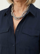 Wrinkle-free maxi button-down dress with point collar, chest pockets, and side slits