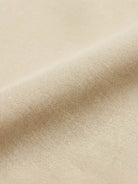 Maxi-length wrinkle-free button-down dress with point collar, chest pockets, long roll-up sleeves, side slits, and relaxed straight silhouette