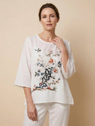 100% cotton linen hand-embroidered shirt with 3/4 flared sleeves and asymmetric hem