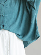 Oversized linen-cotton blouse with batwing sleeves and tang knot closures