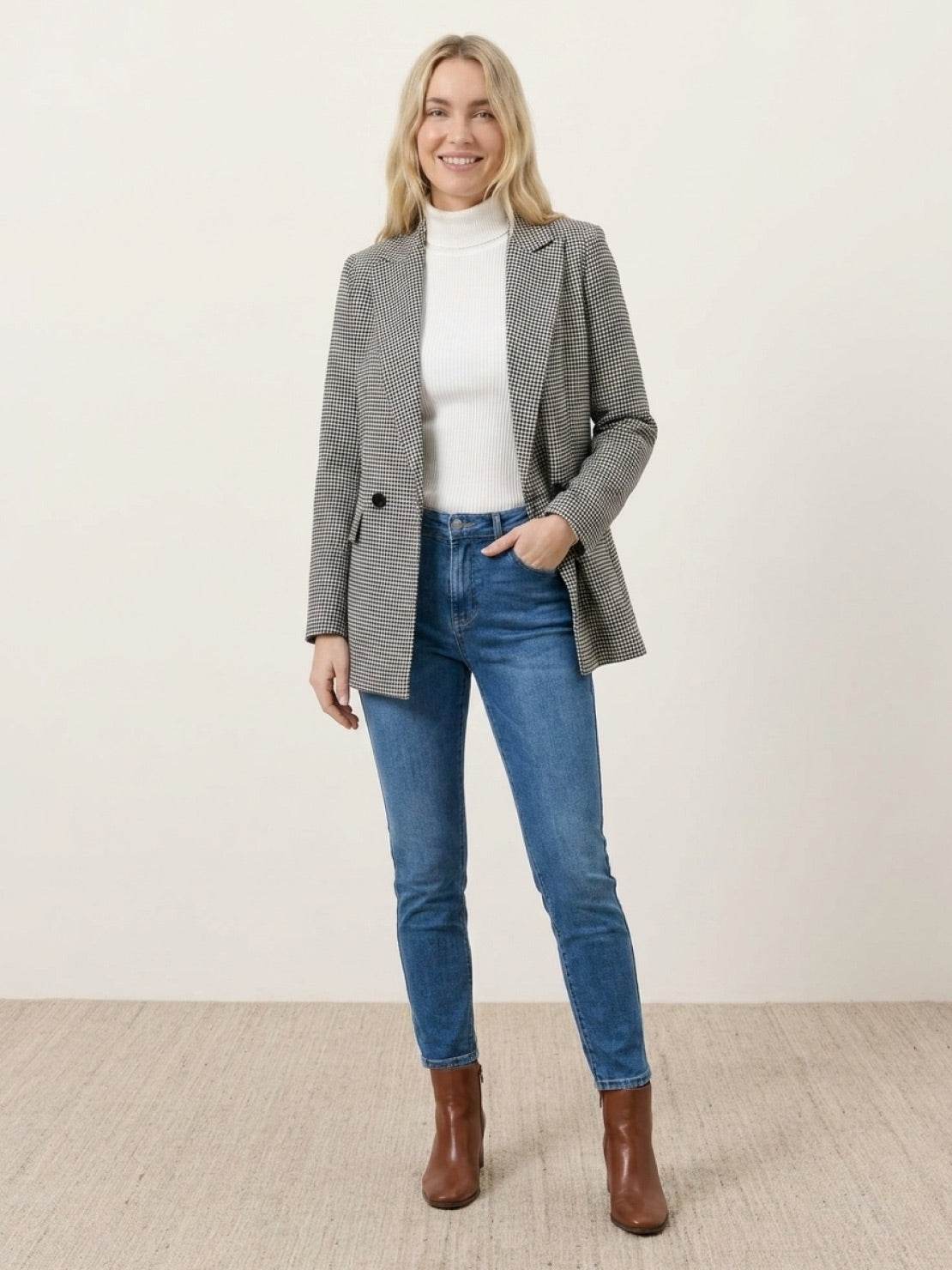 Black and white houndstooth commuter blazer with structured shoulders and relaxed fit
