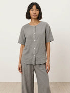 100% cotton two-piece set with button-front top and wide-leg pants in soft solid colors