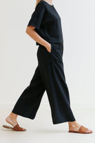 woman wearing breezy meadow two-piece set with relaxed fit and wide-leg trousers