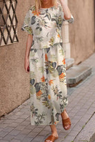 woman wearing Breezy Meadow Two-Piece Set with relaxed fit and wide-leg trousers in light fabric