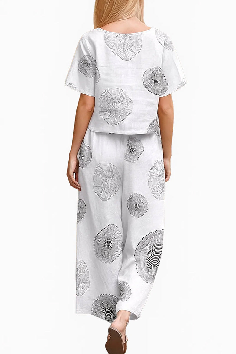 woman wearing Breezy Meadow two-piece set with relaxed top and wide-leg trousers outdoors