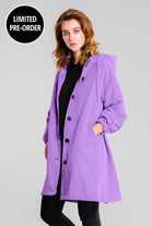 Water Resistant Oversized Windbreaker rain jacket in purple with hood and button closure on model