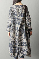 Back view of loose fit Japanese porcelain print midi dress with long sleeves and blue pattern on light beige background