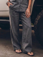 Model wearing oversized 100% cotton shirt and wide-leg pants co-ord set in neutral color