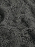 Close-up of soft gray sherpa lining fabric for everyday wear oversized coat