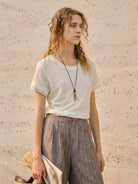 100% linen rolled cuff tee with contrast inner lining and scoop neckline