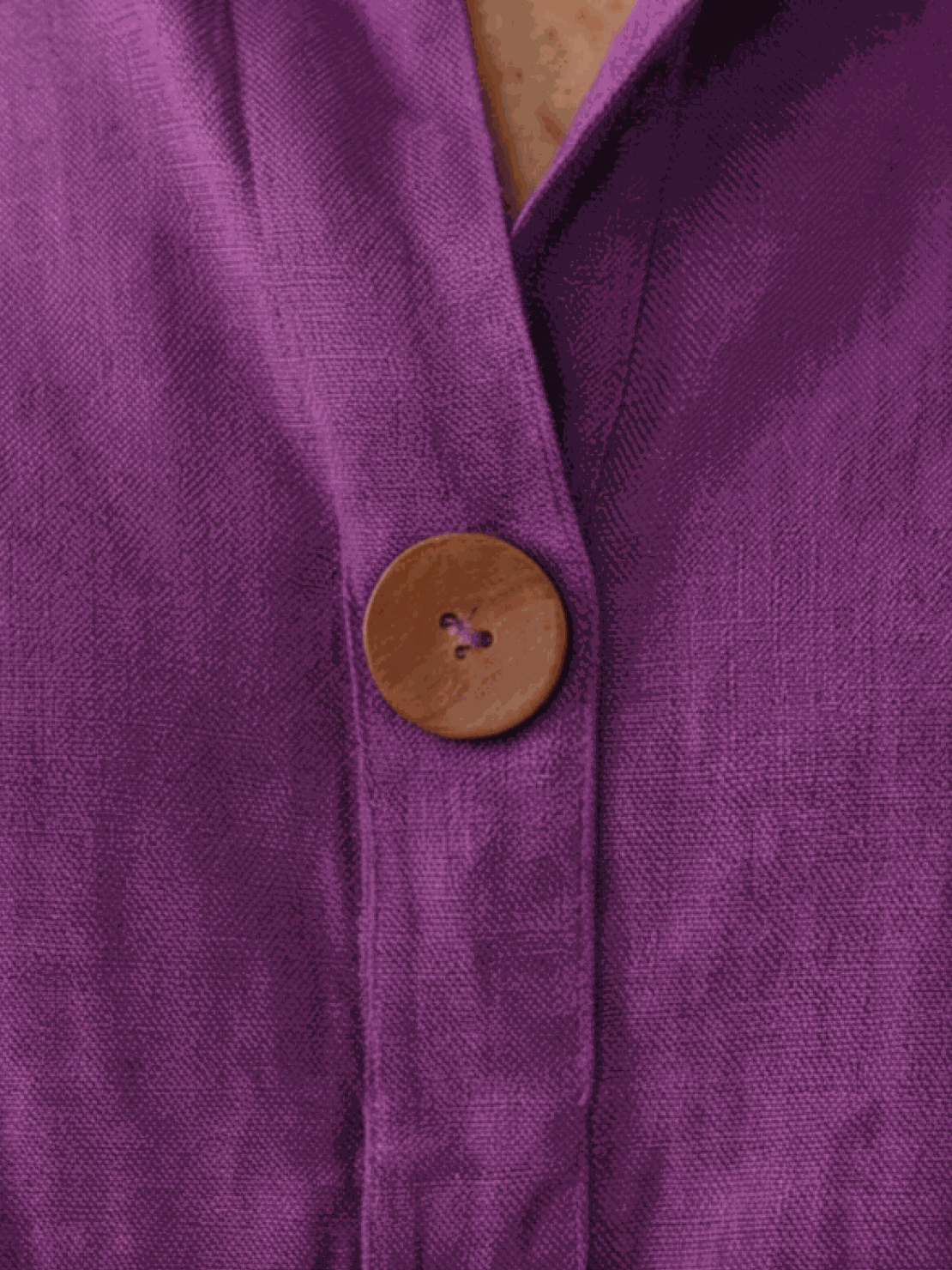 white pure linen age-defying shirt with button detail on hanger