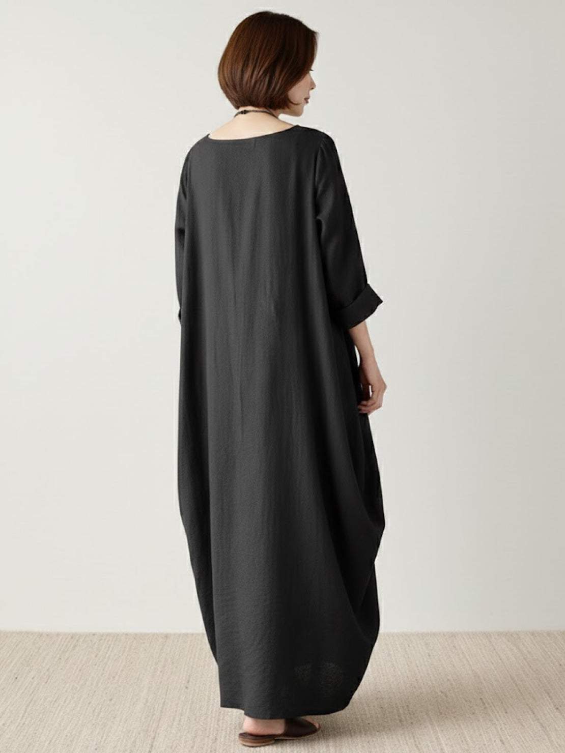 Bohemian maxi dress in loose fit linen blend with long sleeves and floor-length hem
