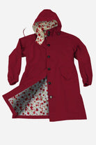 Red oversized Rain Couture Windbreaker with floral printed inner lining and adjustable hood.