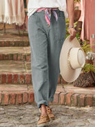 Casual button-down utility-chic trousers with deep pockets and tapered rolled cuffs in soft durable fabric