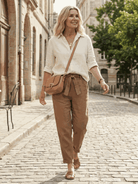 Two women wearing breathable casual chic duo cotton and linen two-piece sets standing outdoors