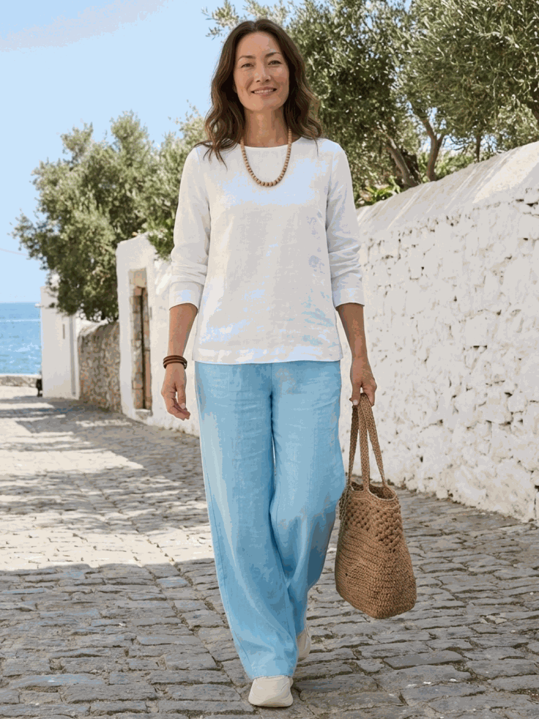 Two women modeling Casual Chic Duo breathable natural fabric outfits, relaxed fits with mix-and-match styling options