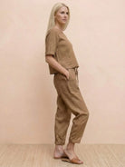 Woman wearing a breathable, breathable cotton linen set with relaxed fit and monochrome design