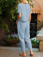 Cotton linen monochrome straight-leg pants with breathable natural texture and relaxed fit
