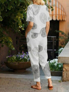Woman wearing a breathable cotton linen set with relaxed short-sleeve top and straight-leg pants in monochrome tones