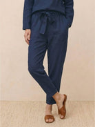 Woman wearing cotton-linen monochrome relaxed longline top and wide-leg pants set