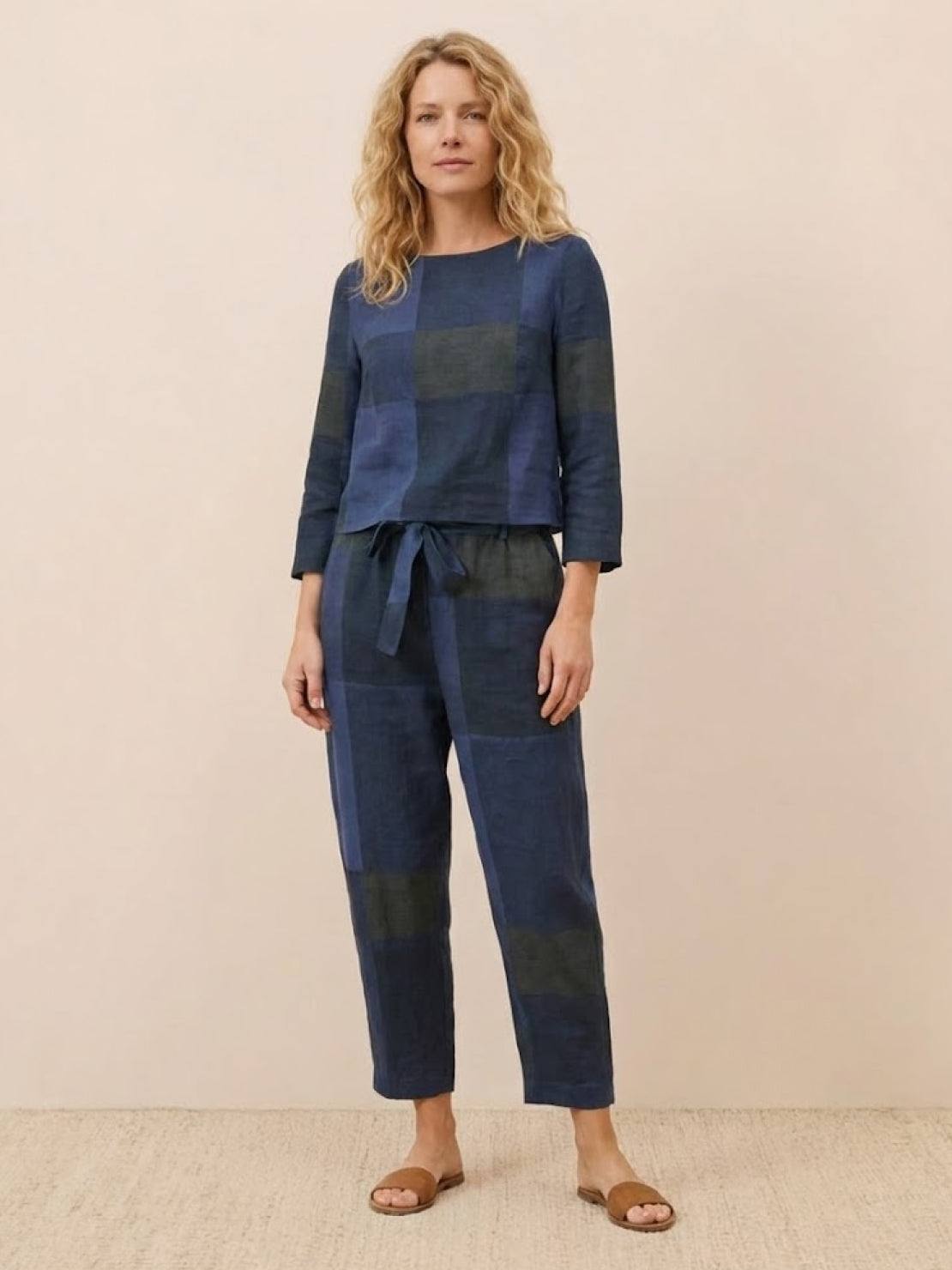 Woman wearing a cotton-linen monochrome relaxed longline top and wide-leg pants set