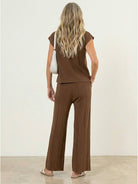 Two-piece first class travel outfit in viscose-acrylic blend with pleated wide-leg pants and matching top