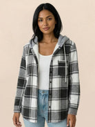Highland Plaid Shacket with soft fleece lining, hood, button-front, and front pockets in classic plaid pattern.