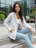 Highland Plaid Shacket with soft fleece lining, hood, button-front, and front pockets in classic plaid pattern