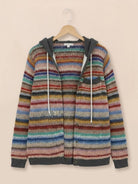 Woman wearing Highland Plaid Shacket with hood and button-front in autumn setting