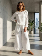 loose solid color two-piece set with round-neck pullover and wide-leg pants in soft breathable fabric