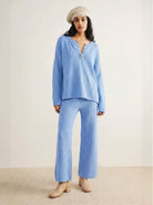 Woman wearing multi-weather comfort two-piece oversized set with relaxed fit and wide cropped pants