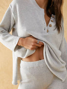 Woman wearing multi-weather comfort two-piece oversized set with relaxed fit and cropped wide pants