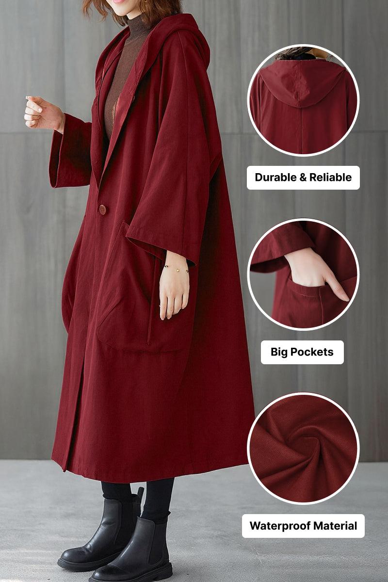 Oversized maroon waterproof windbreaker jacket with hood, large pockets, and durable design