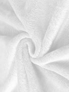 Close-up of soft white plush faux fur fabric for open front oversized fur jacket