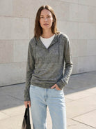 Organic Linen Henley top in fine knit with relaxed fit, 3-button placket, long sleeves, side slits, and breathable fabric.