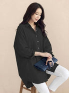 Oversized linen shirt in breathable cotton blend with relaxed fit and back button details