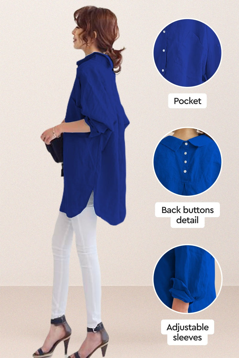 Oversized linen shirt in blue with back button detail, adjustable sleeves, and relaxed fit, styled with white pants and heels