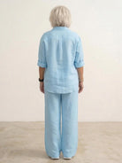 Woman wearing oversized 100 cotton shirt with wide-leg pants co-ord set in neutral tone