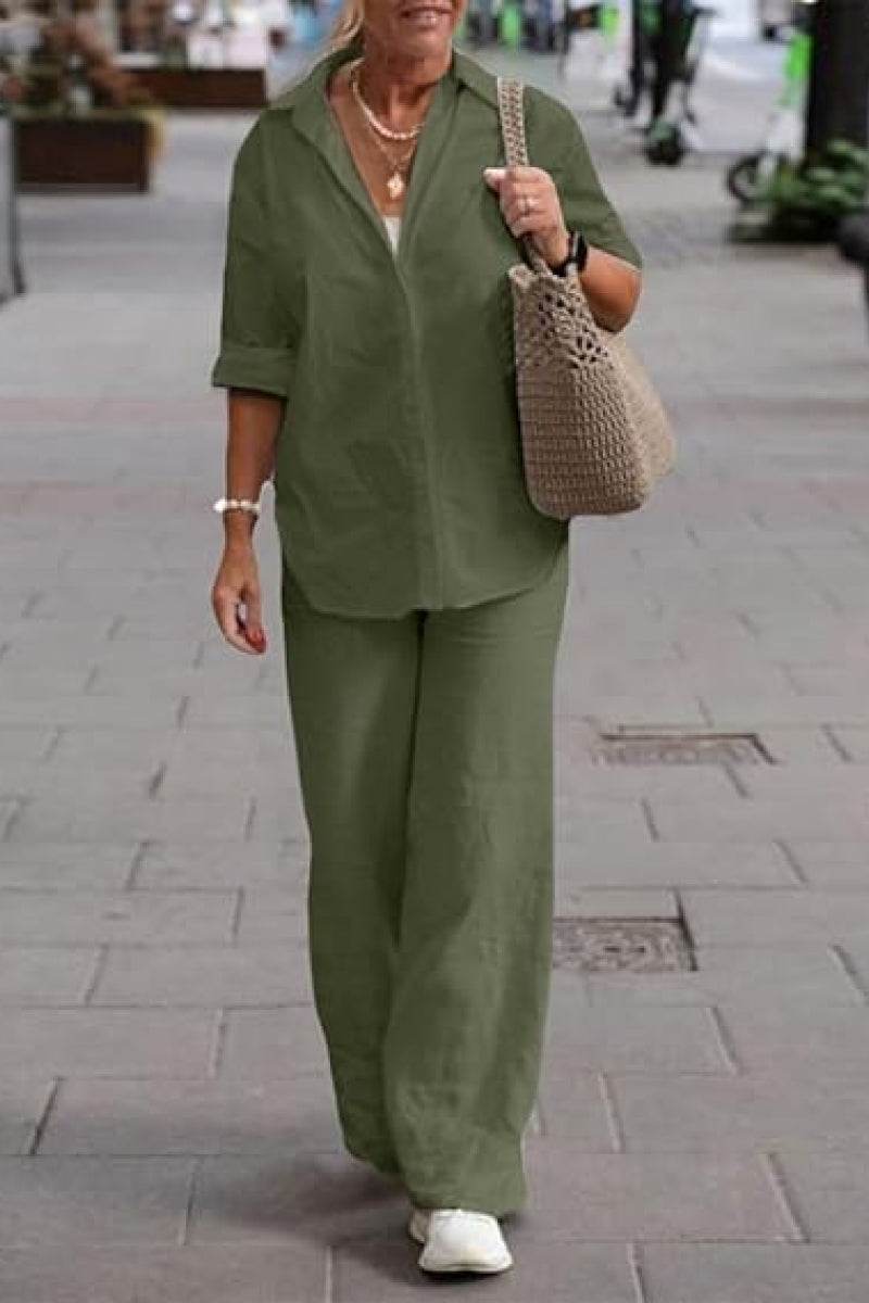 Woman wearing oversized 100% cotton olive green shirt and wide-leg pants co-ord set walking outdoors