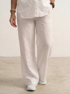 Woman wearing an oversized 100% cotton shirt and wide-leg pants co-ord set in a relaxed, breathable fit