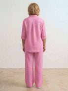 Woman wearing oversized 100% cotton shirt with wide-leg pants co-ord set in relaxed style