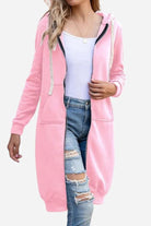 Women wearing pink oversized long zip sweatshirt hoodie with fleece lining and front pockets