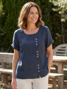 Relaxed fit linen button-up tee with breathable cotton, short sleeves, round neck, and stylish button detail for comfort and style